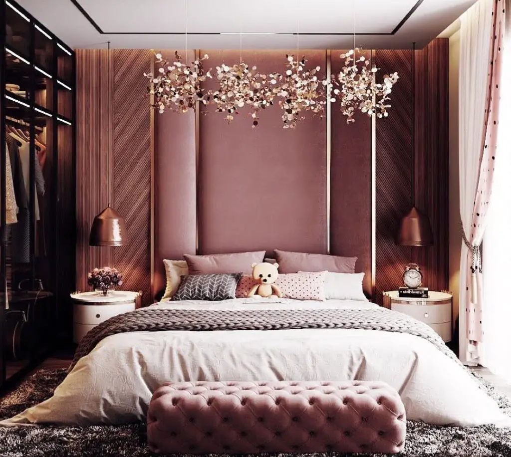 Victorian pink bedroom with canopy bed and floral wallpaper