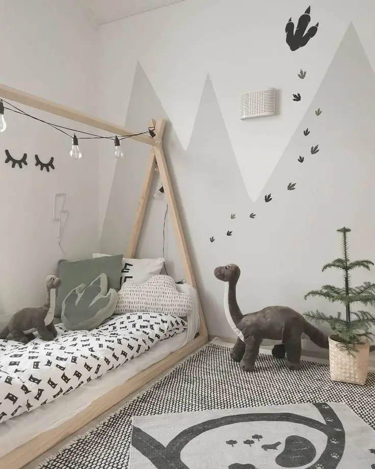 Minimalist kids room with teepee bed frame dinosaur decor and wall graphics