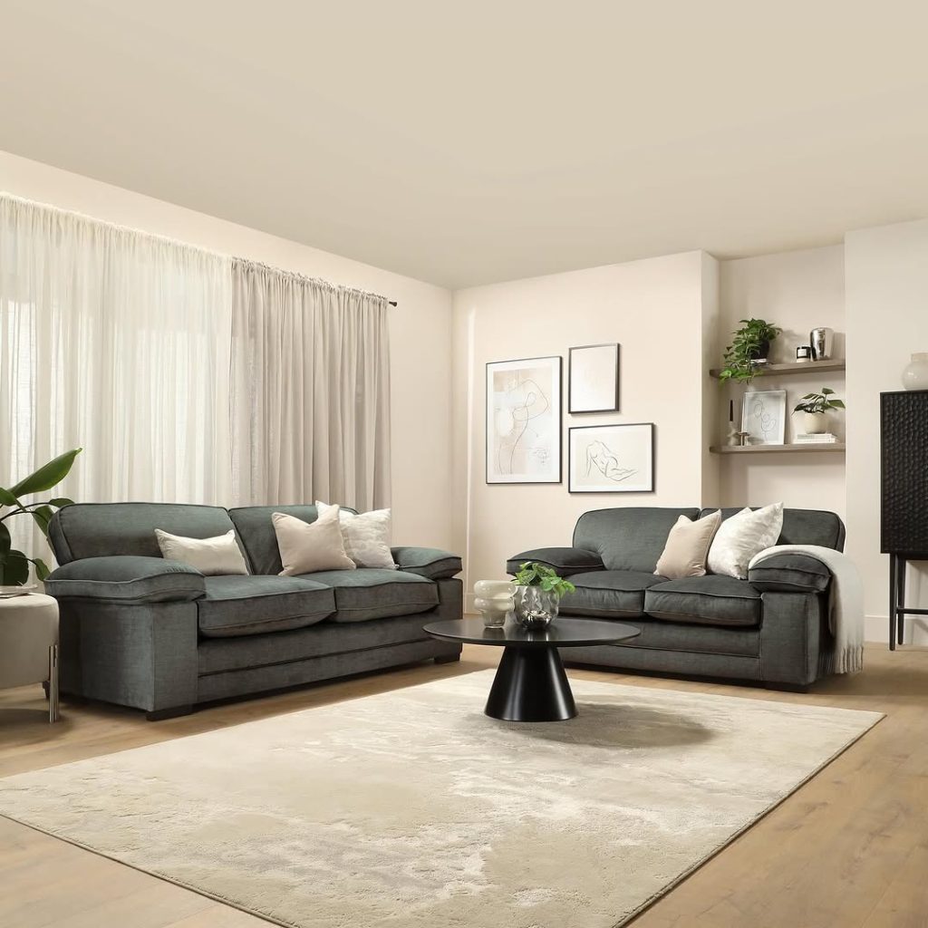 Modern room with wooden decor green couch and abstract art