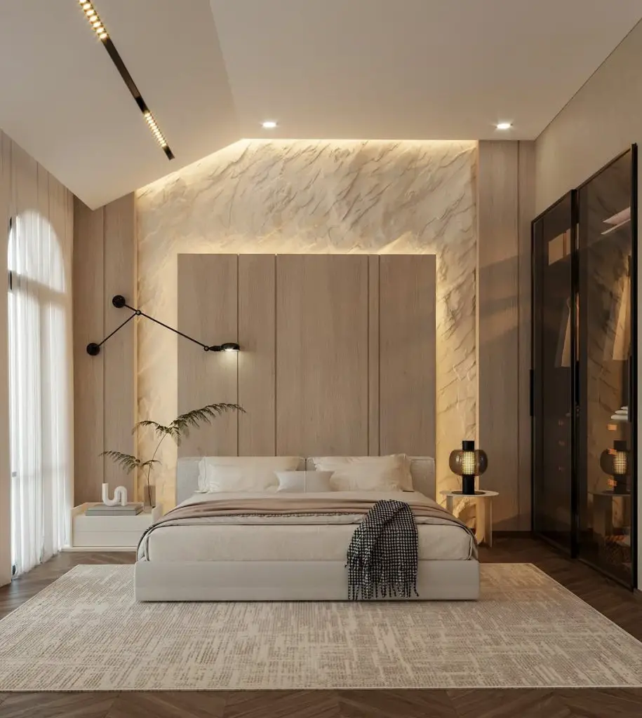Modern bedroom with marble wall paneling and adjustable light fixtures