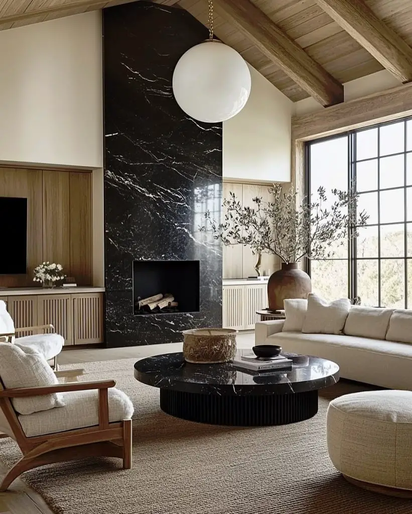 Living room with wood paneling round coffee table and velvet accent chairs