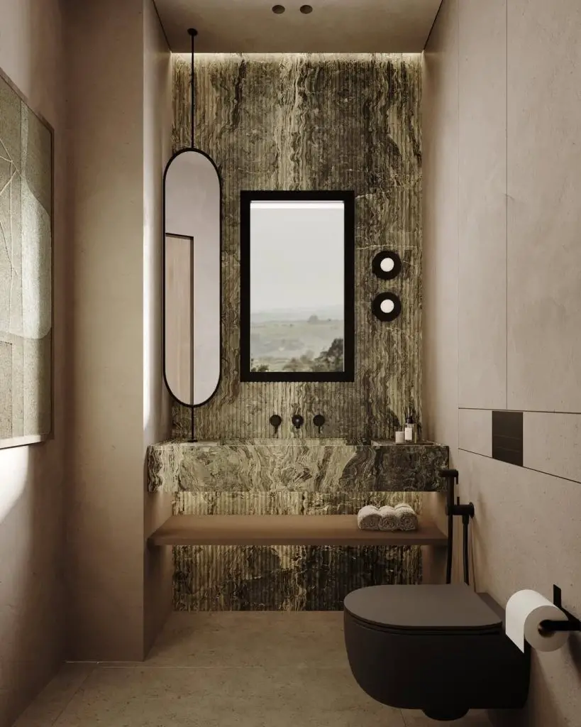 Modern powder room with textured stone wall and floating shelf