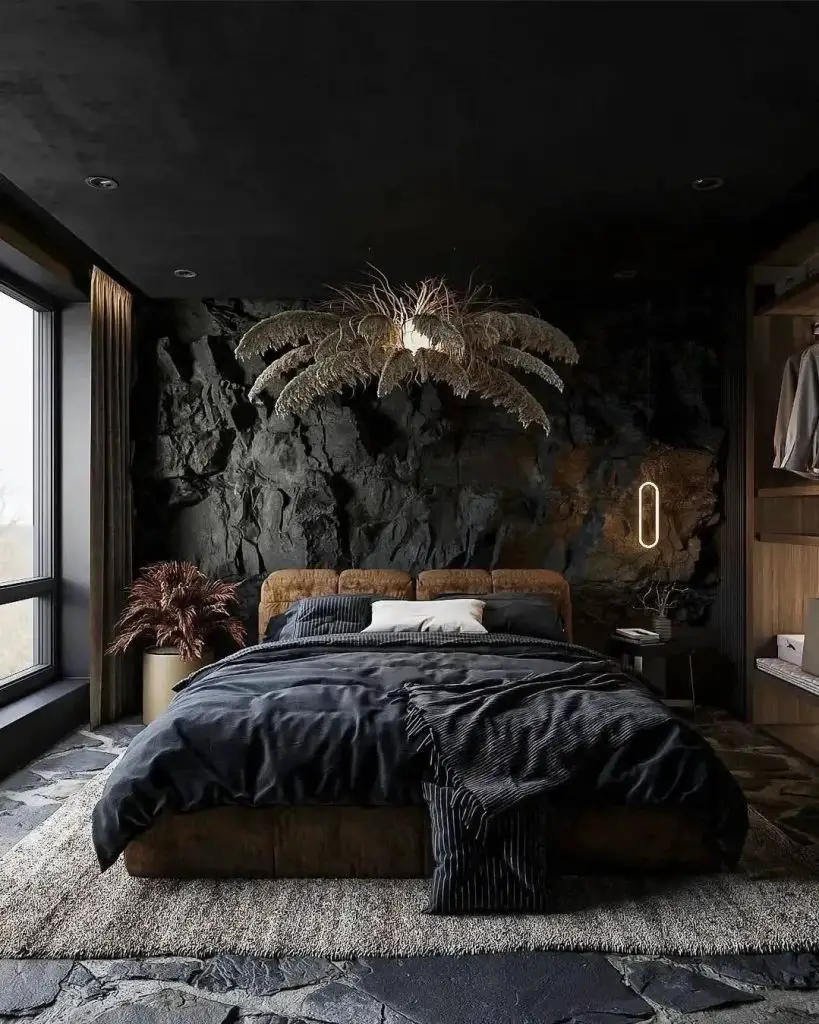 Dark bedroom with rock wall and illuminated palm decoration