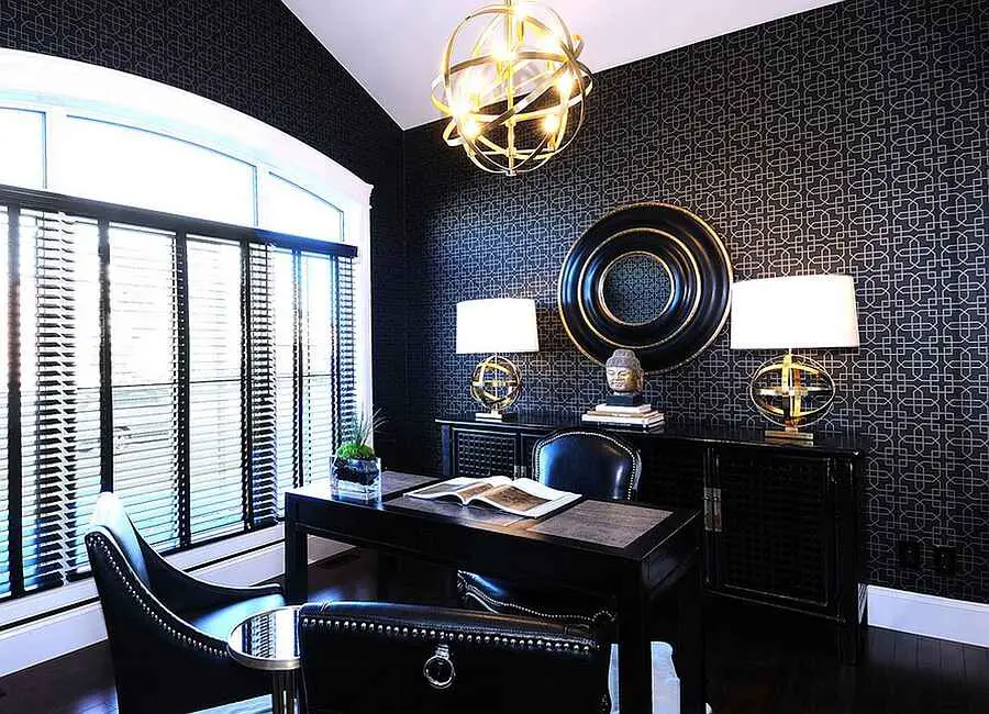 Modern office with glass walls and coral accent chair