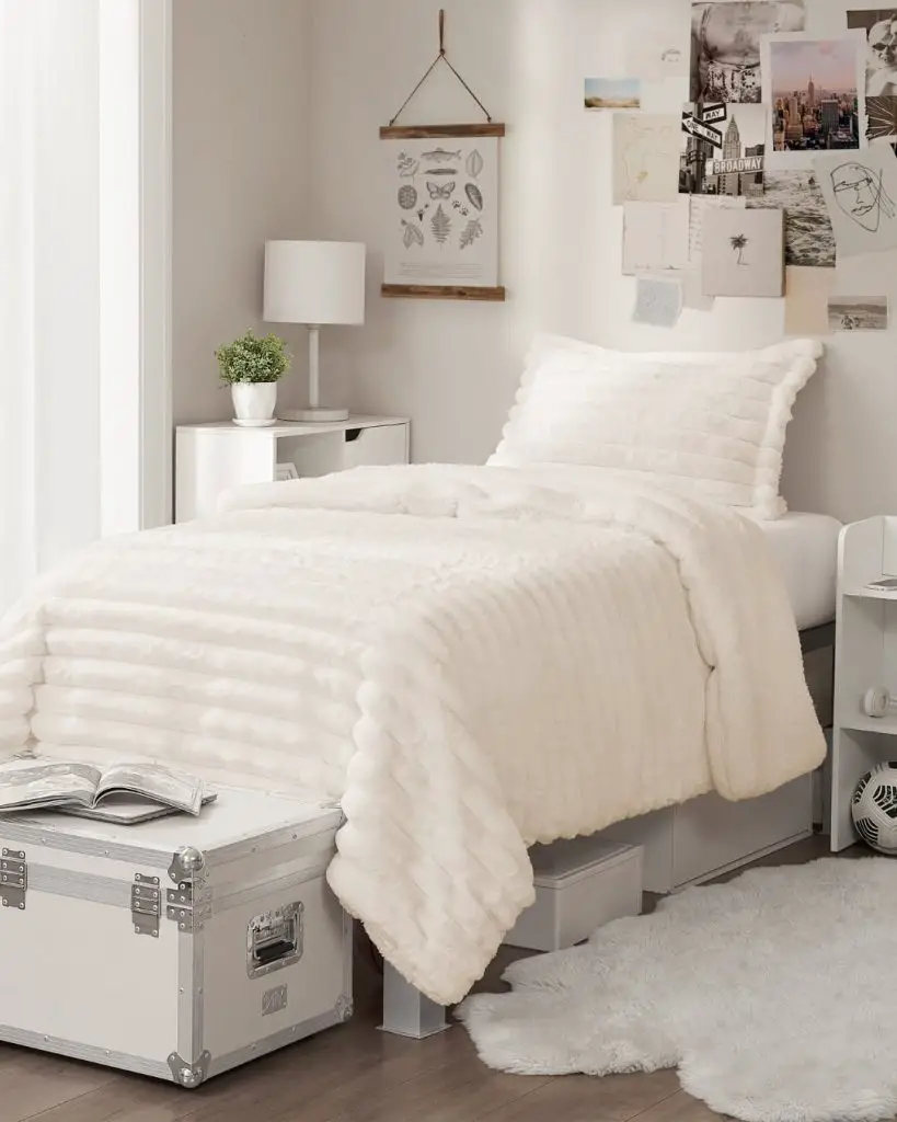 Black bedding with black and white photo gallery wall display
