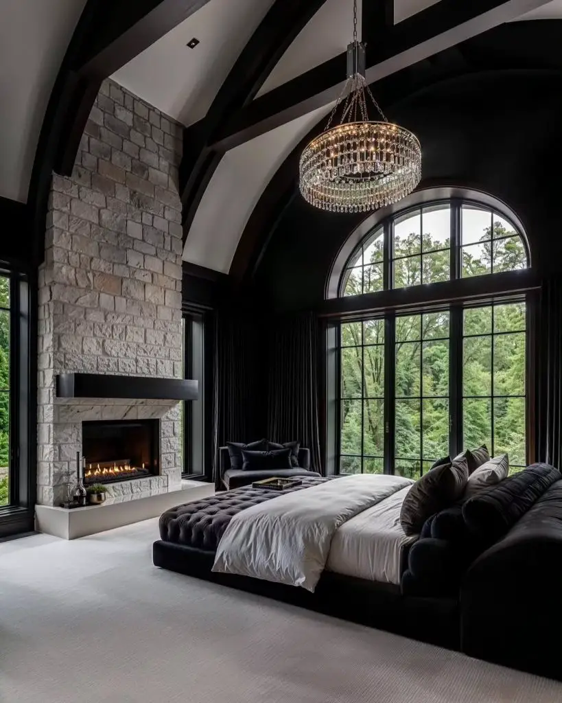 Modern gothic bedroom with vaulted ceiling and stone fireplace.
