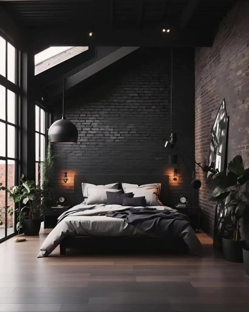 Dark industrial bedroom with brick walls and large windows