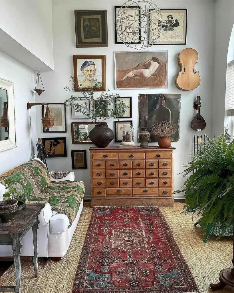 Living room with vintage cabinet gallery wall and antique decor.