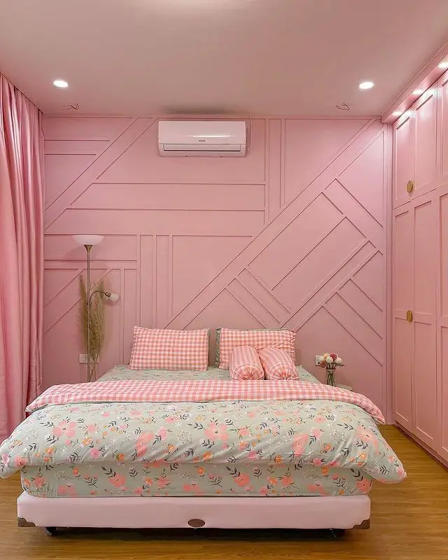 Pink bedroom with ocean view modern chandelier and floral decor