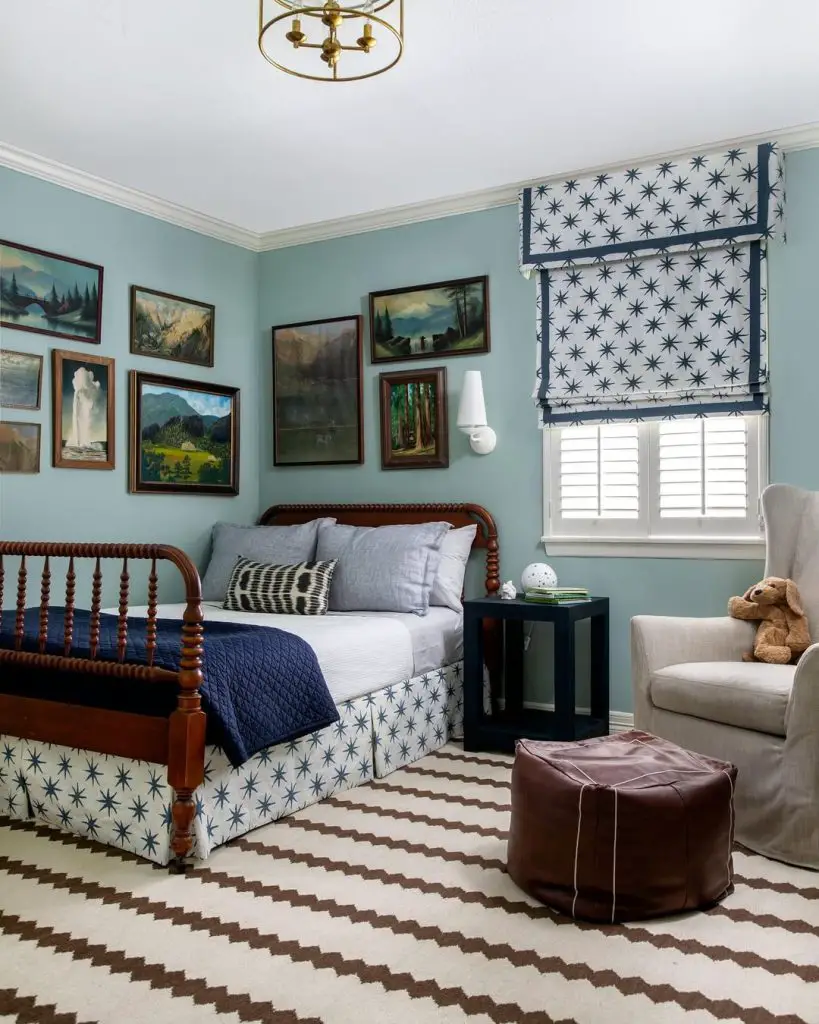 Boys bedroom with mountain art spindle bed and star shades