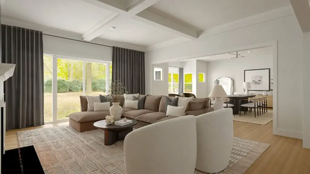Bright living room with brown sectional white chairs and large windows