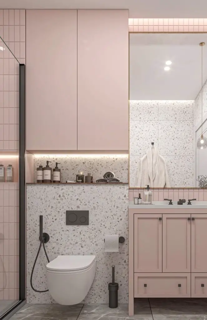Pink bathroom with terrazzo walls and black fixtures