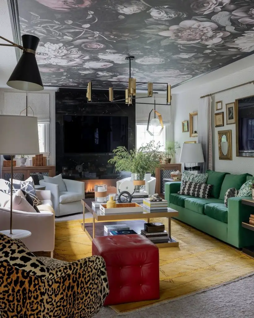 Living room featuring floral ceiling green sofa and modern lighting