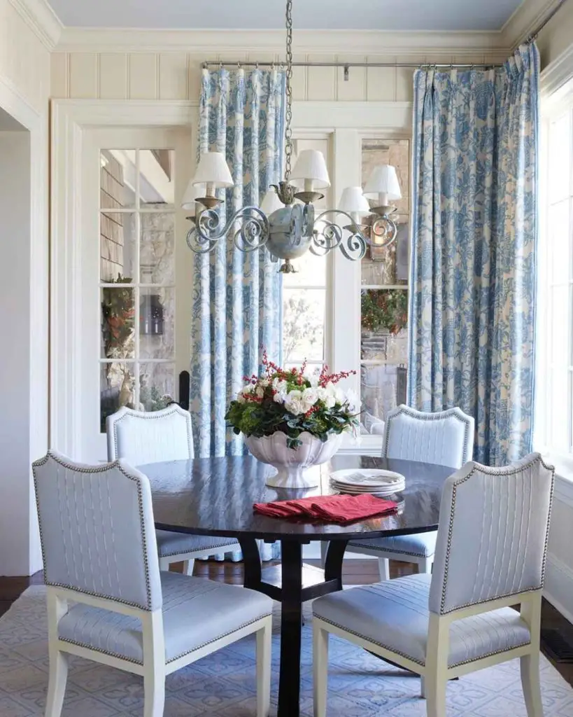 Modern dining room with globe chandelier and holiday table setting