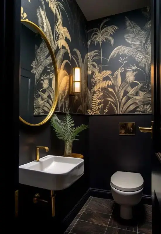 Black powder room with gold accents palm wallpaper and floating sink