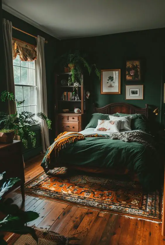 Cozy dark green bedroom with vintage furniture and orange accent rug