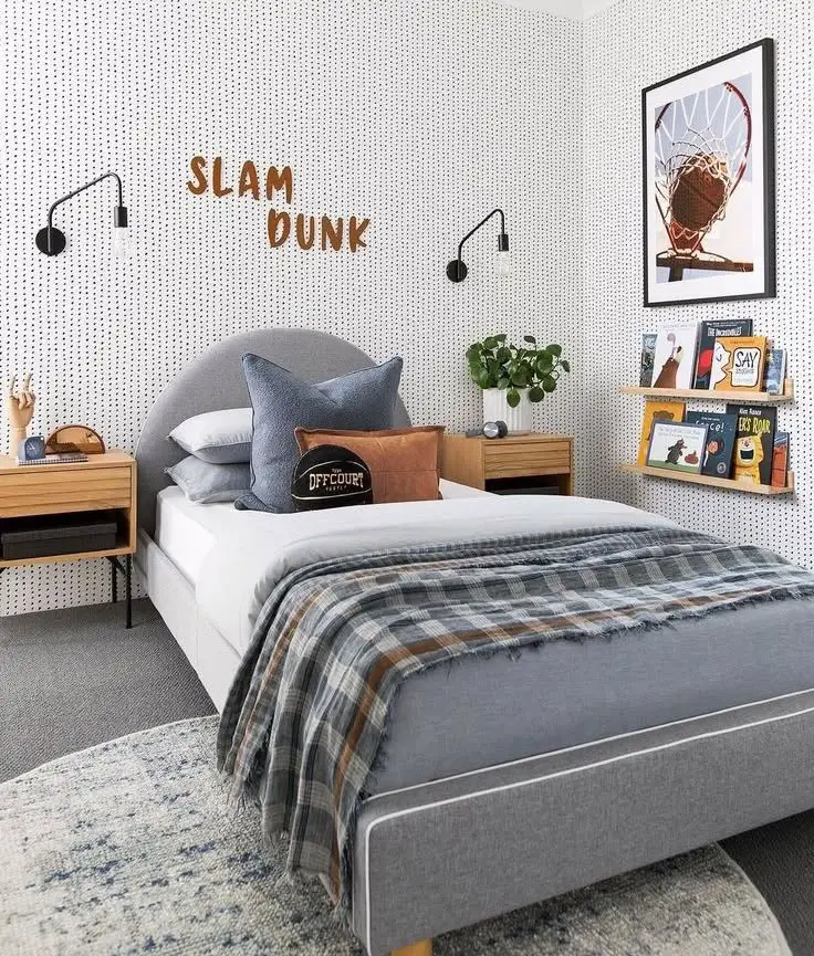 Sports themed bedroom with basketball decor modern lighting and gray upholstered bed