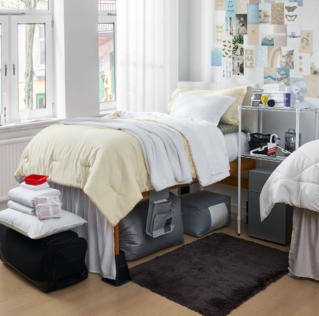 Cream colored bedding with artistic wall collage and storage solutions