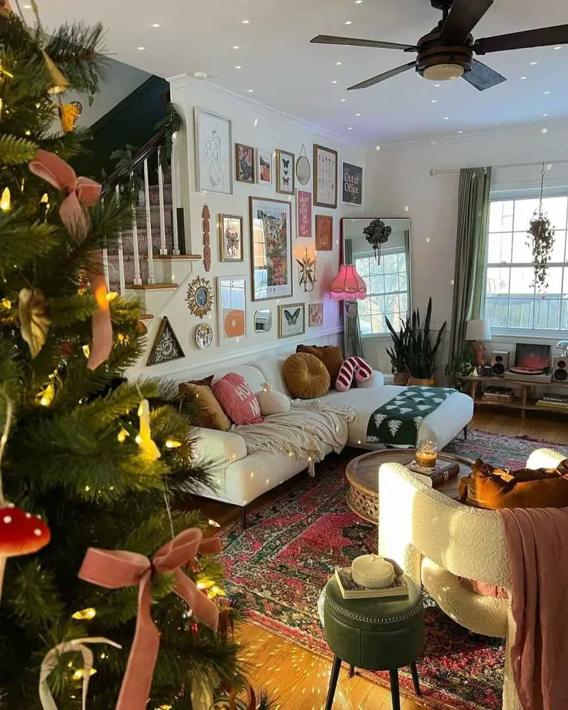 Living room with Christmas tree white couch and eclectic gallery wall