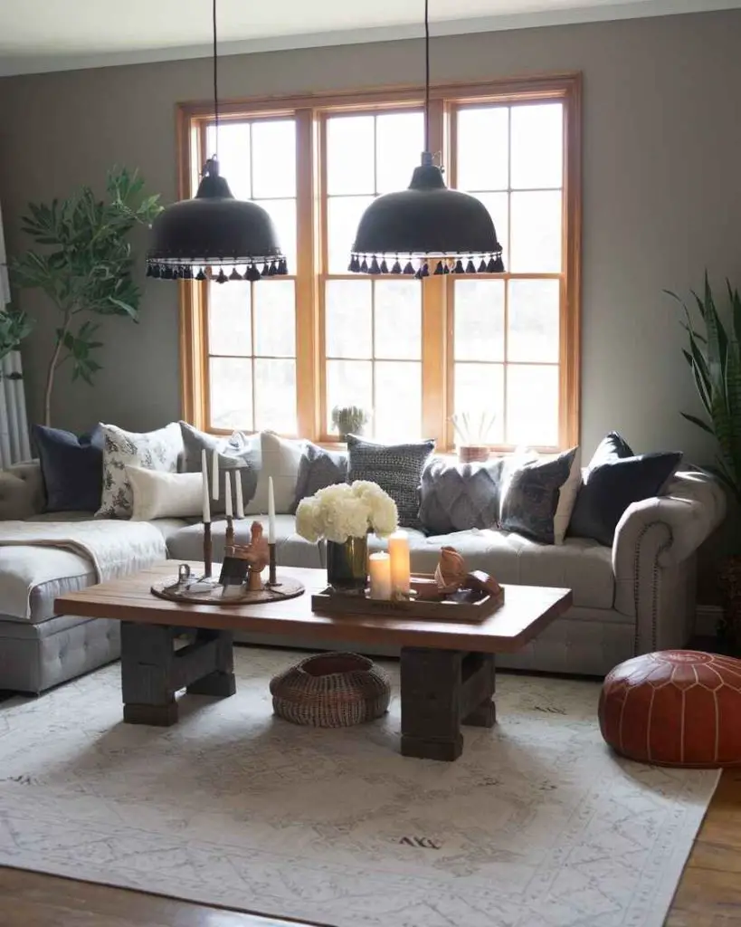 Living room with tasseled black pendant lights and gray sectional sofa