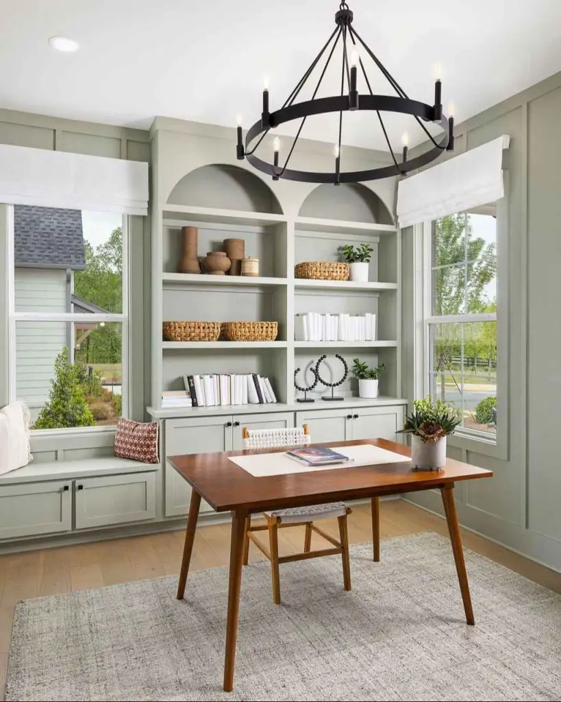 Office with wooden beams trestle desk and nature artwork