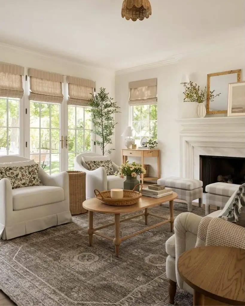 Bright living room with white furniture bamboo shades and indoor plants