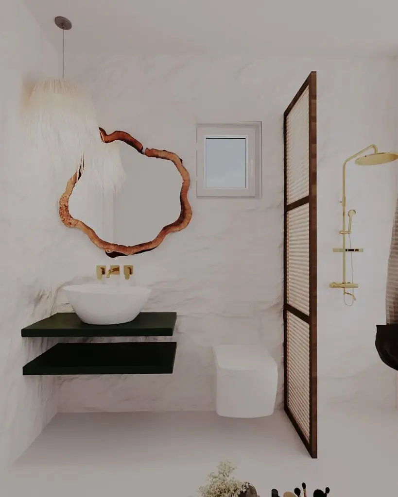 White bathroom with curved wooden mirror green shelves and gold fixtures