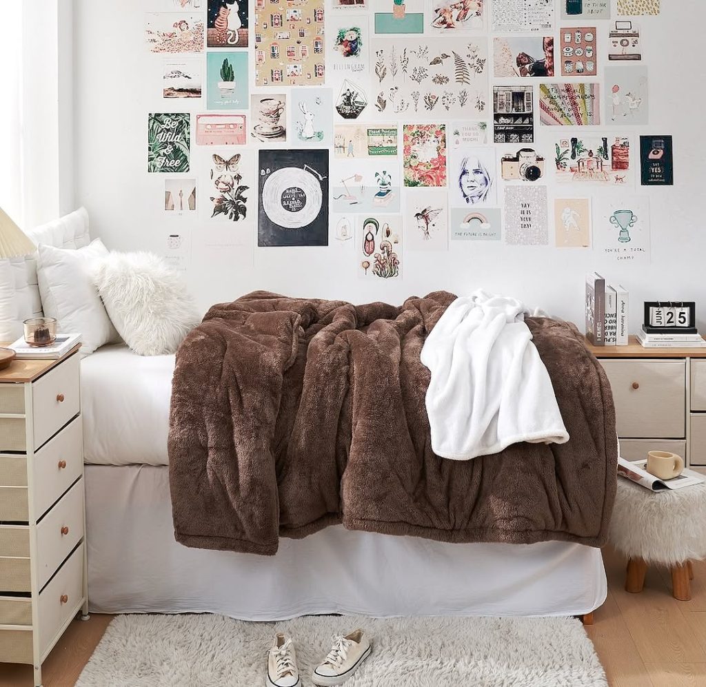 Wooden loft bed with desk and storage underneath string lights