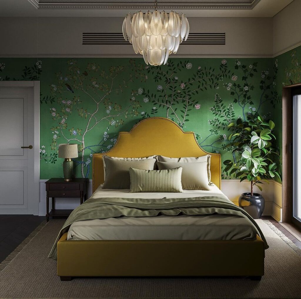 Elegant bedroom with green floral wallpaper and gold upholstered bed