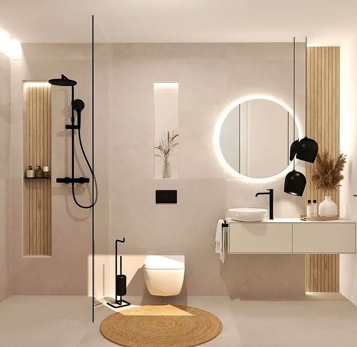 Modern beige bathroom with floating vanity black fixtures and round mirror