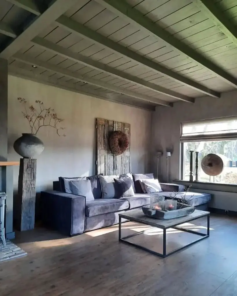 Gray living room with wooden beam ceiling and modern furniture
