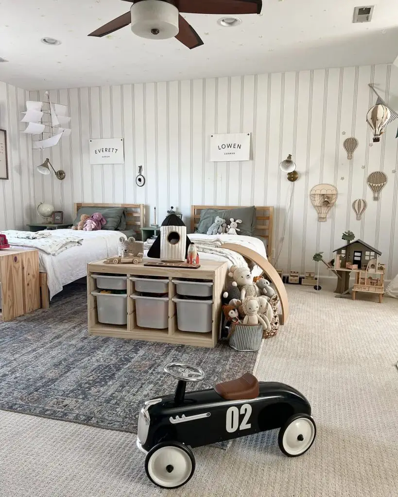 White bunk bed room with built in desk and polka dot walls