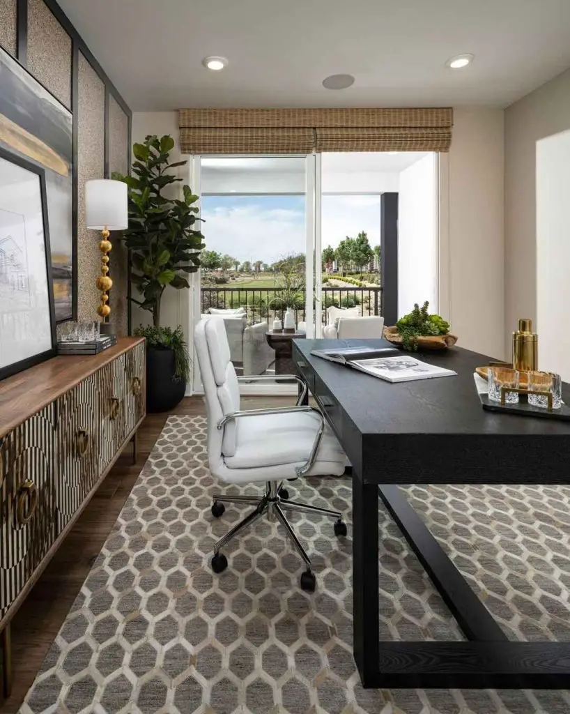 Black wall office with modern art and stacked base desk