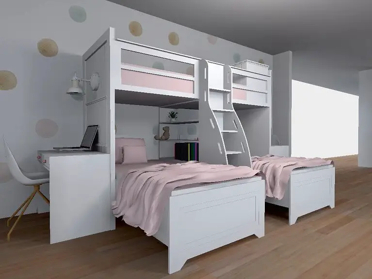 Boys bedroom with geometric pattern wall and pink bedding