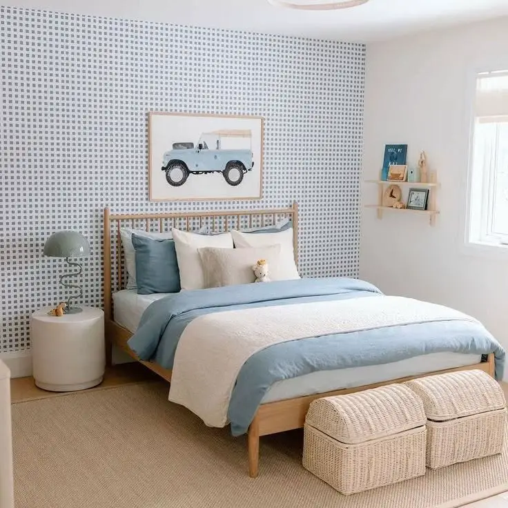 Coral bedroom with vintage artwork and dark wood bed frame