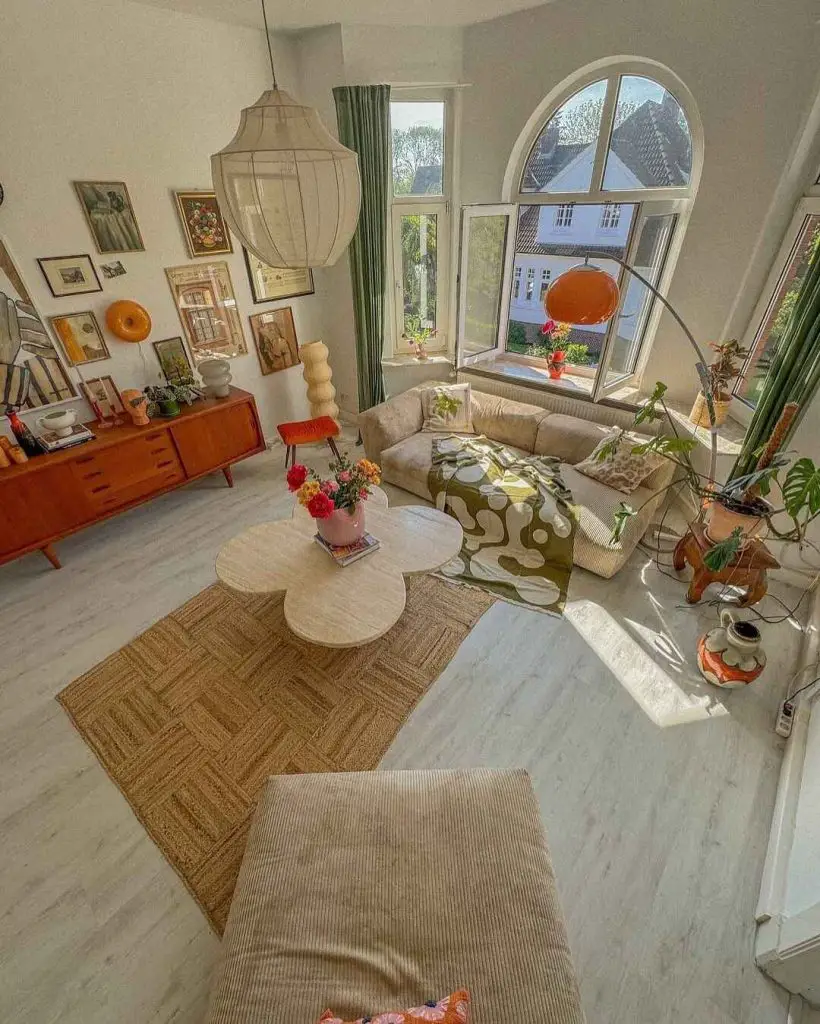 Bright corner living room with arched windows and retro furniture