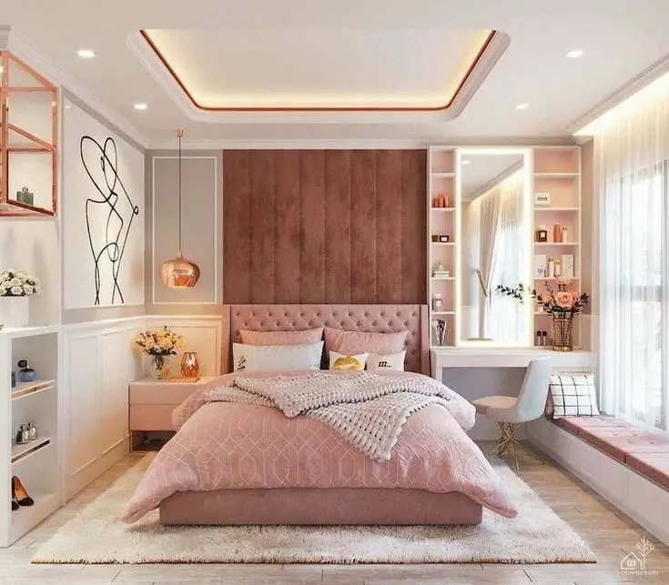 White and pink bedroom with geometric rug and brass accents