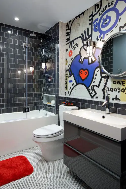 Modern bathroom with blue graffiti art dark tiles and floating vanity