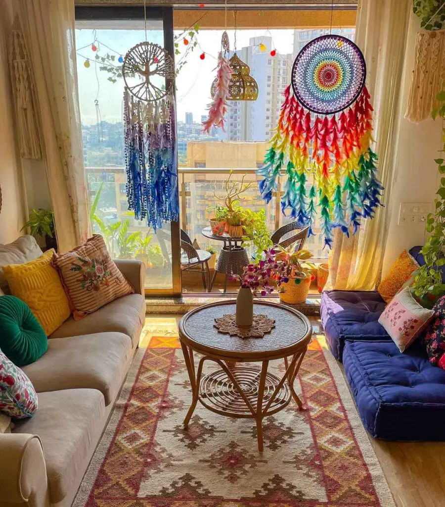 Colorful bohemian living room with rainbow dreamcatchers hanging plants and comfortable seating area