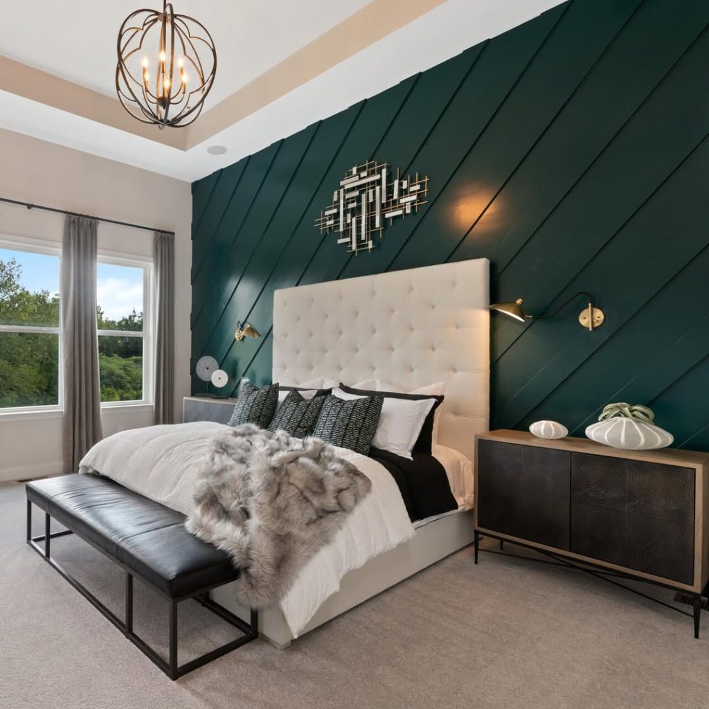 Built in arched shelving frames bed with brown leather headboard