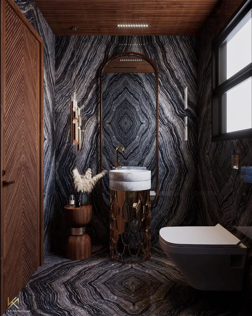 Dark marble bathroom with bronze accents and wooden details