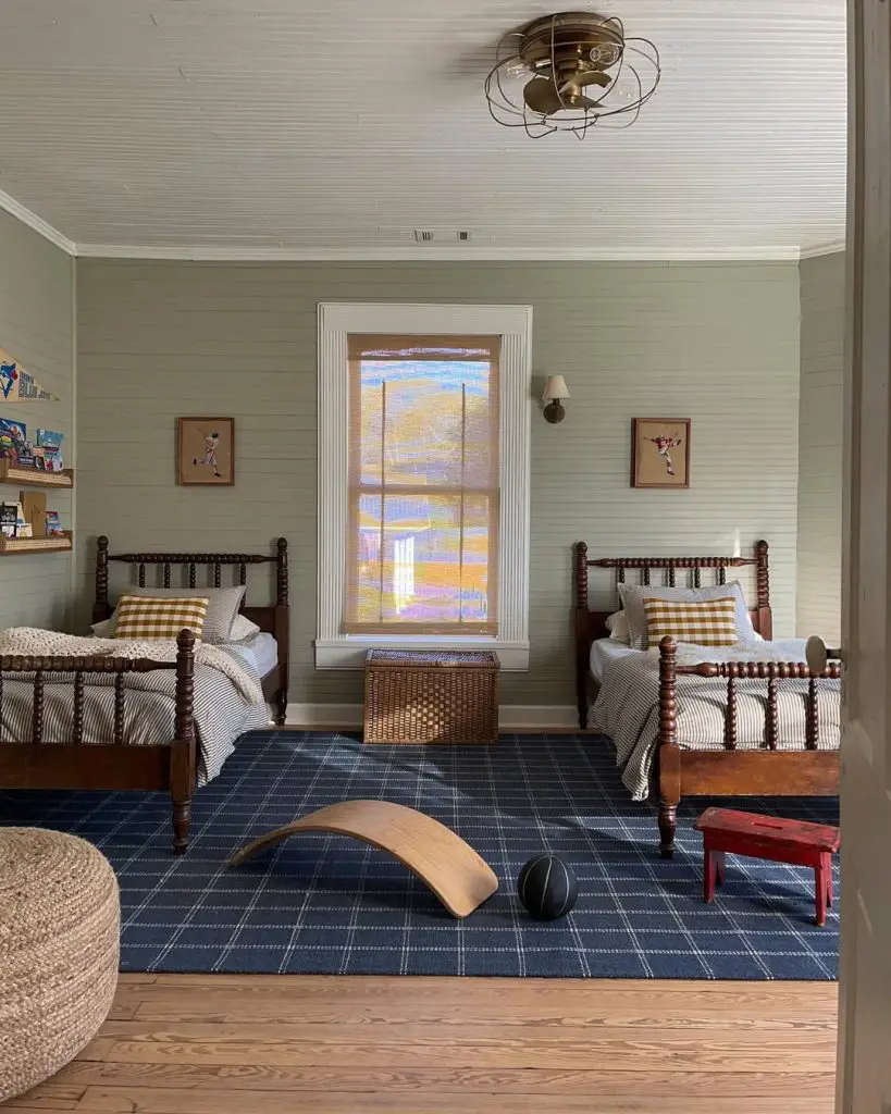 Twin bedroom with vintage sports theme and navy plaid rug
