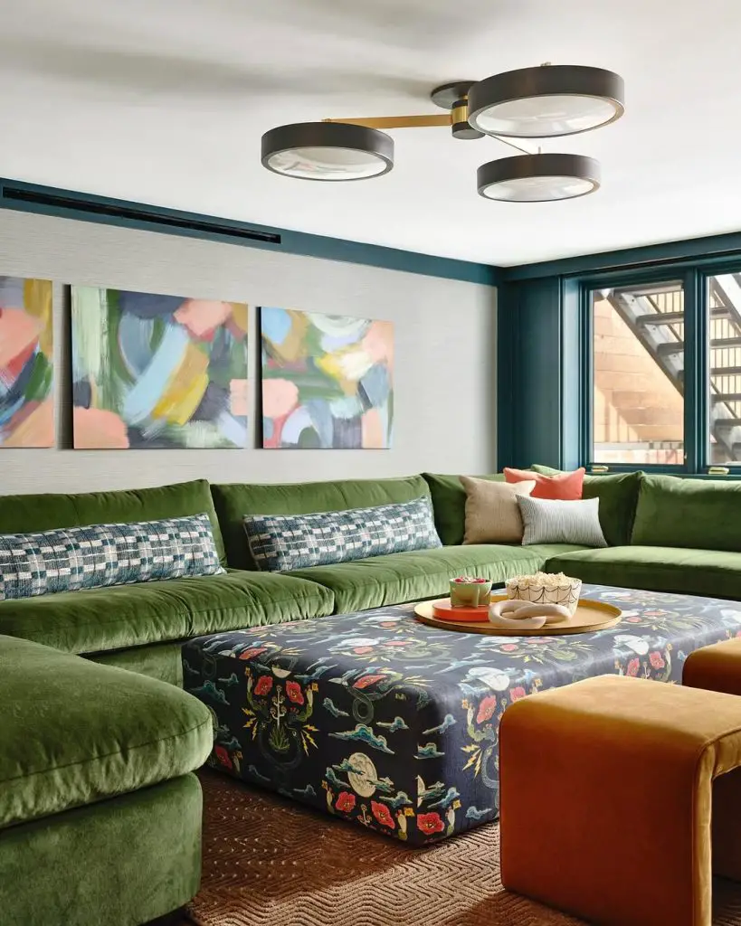 Modern living room with green sectional patterned ottoman and abstract art