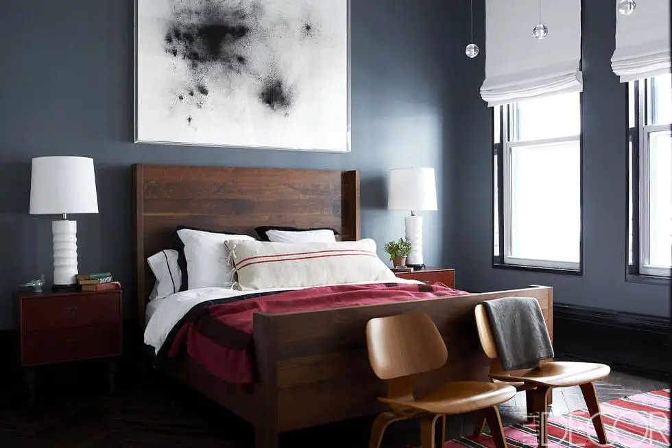 Bright minimalist bedroom with house plants window and boston terrier on bed