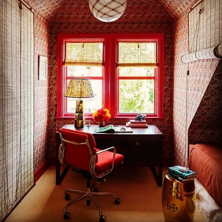 Wooden desk home office with floating shelves and guitar display