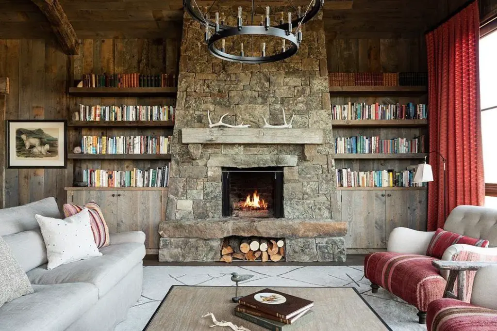 Modern ranch style living room with stone fireplace and western decor