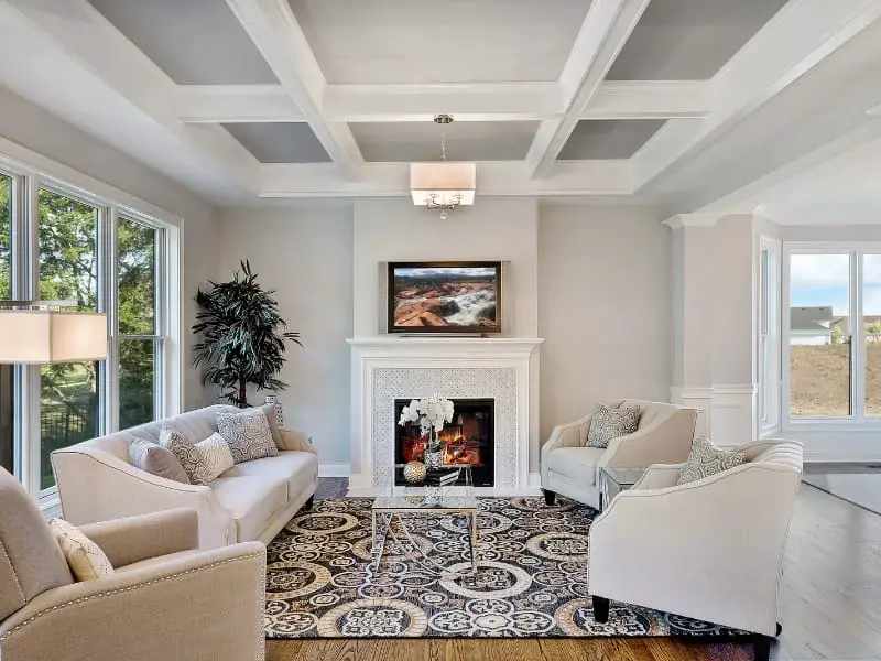 Contemporary coffered ceiling with classic fireplace