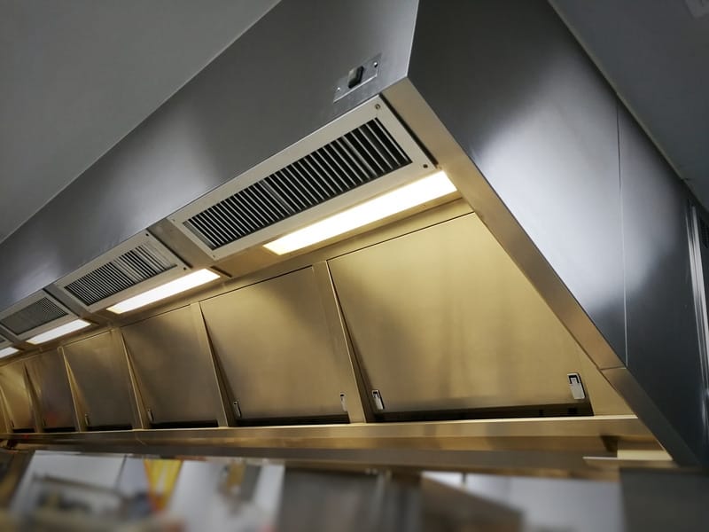 Professional kitchen ventilation hood installation setup
