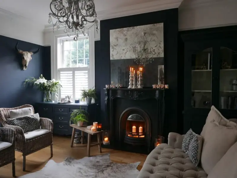 Dark moody room with candle-lit fireplace