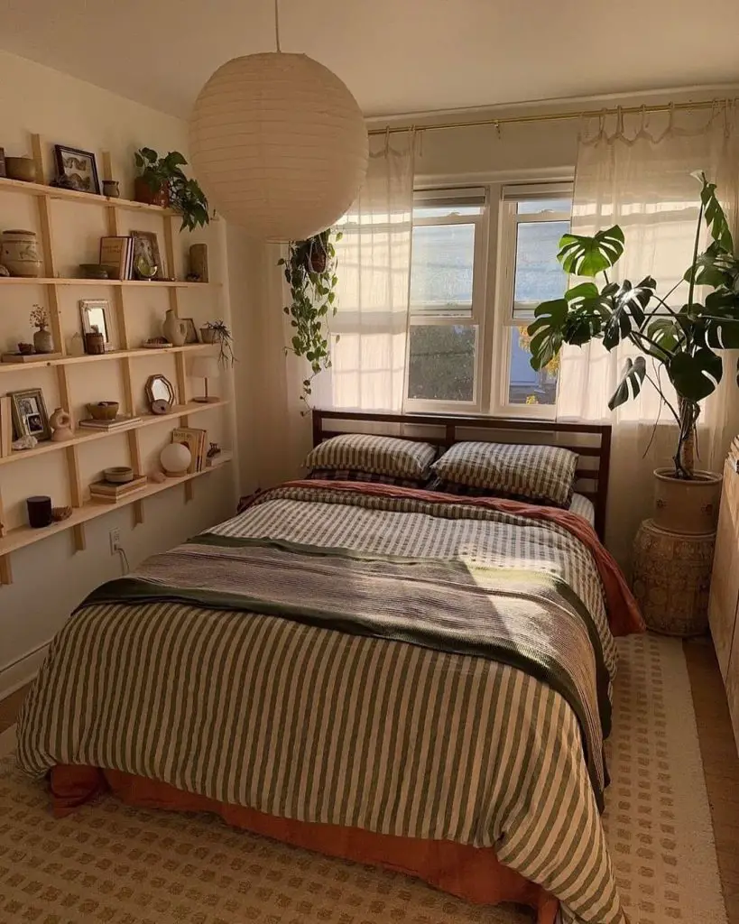 Cozy bedroom with wooden shelves paper lantern and hanging plants near window